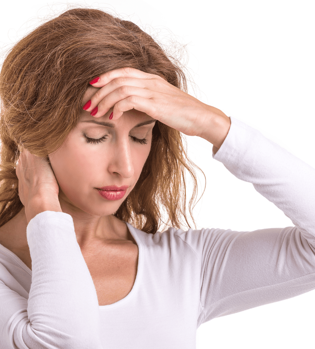 Woman in white shirt touching her forehead, looking distressed.