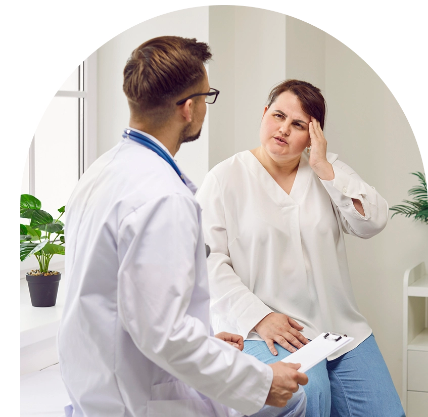 Doctor consulting with a patient in office.