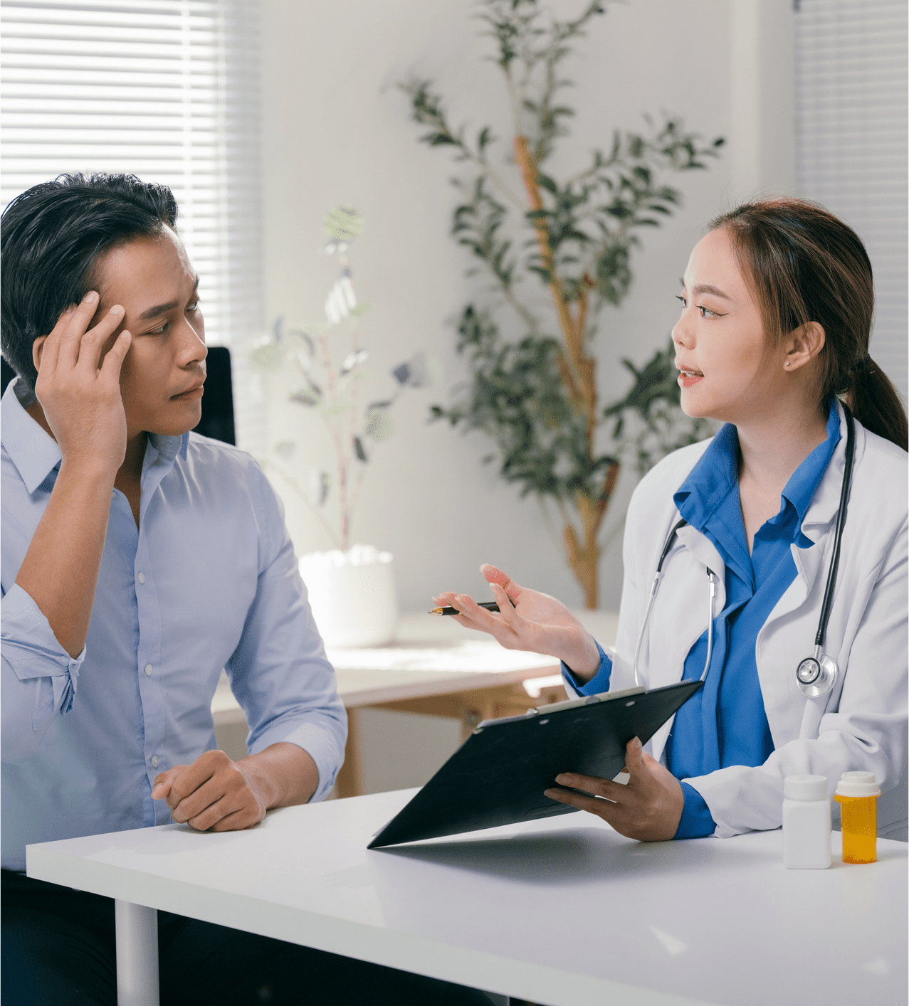 Doctor consulting a patient in a bright, modern clinic.